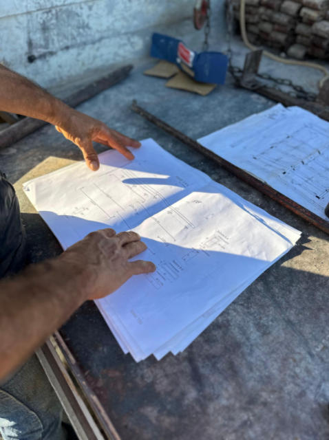 Engineer reviewing gas system drawings and requirements