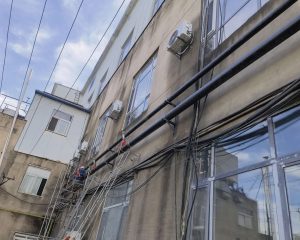 Gas pipeline risers installed on building exterior